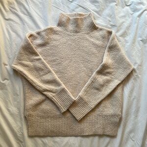 Cozy Joie sweater in Cream.